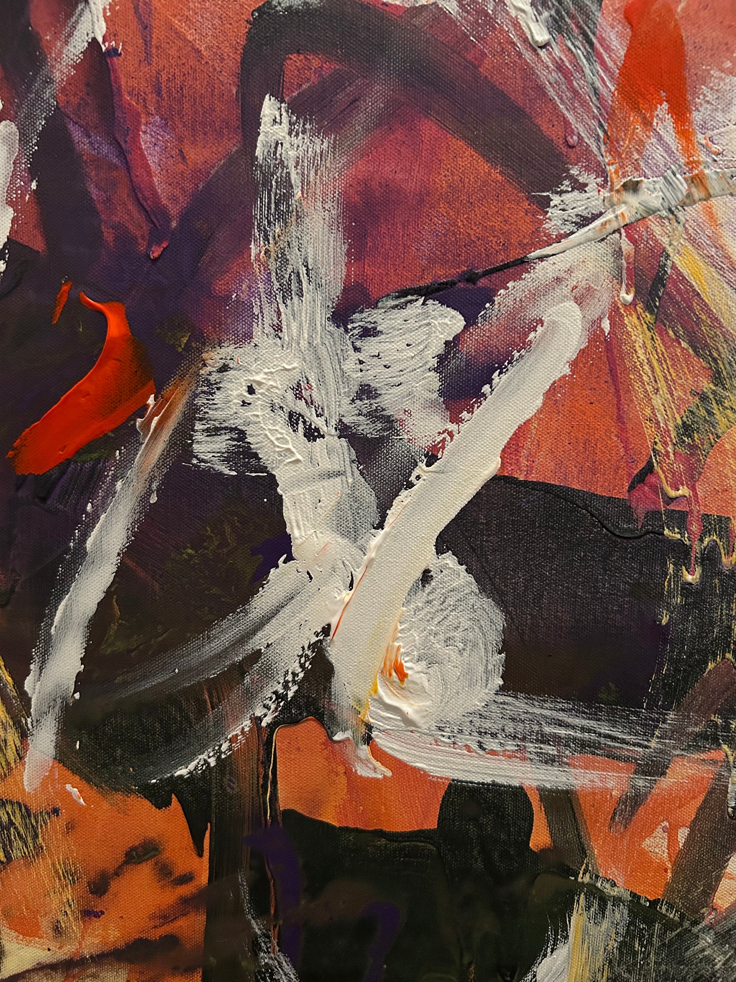 Abstract painting with a mix of red, black, white, and orange colors.